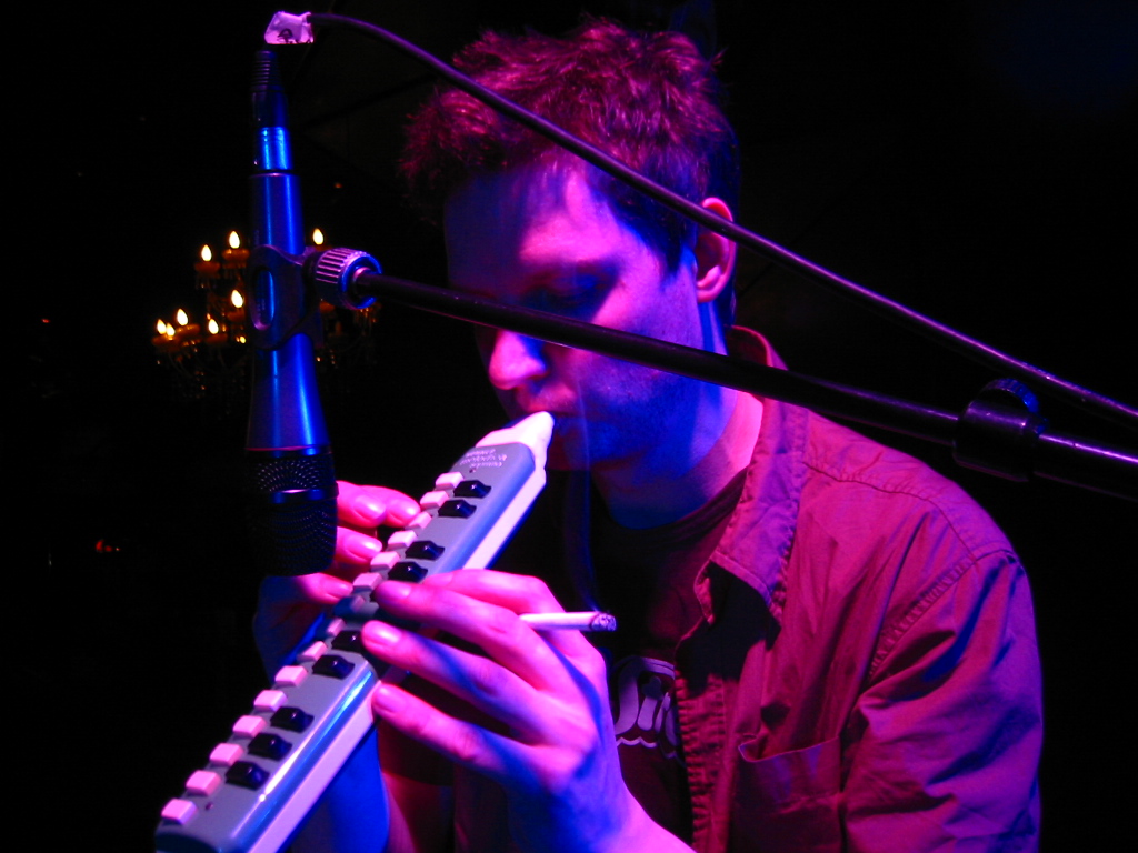 a man with a keyboard and microphone