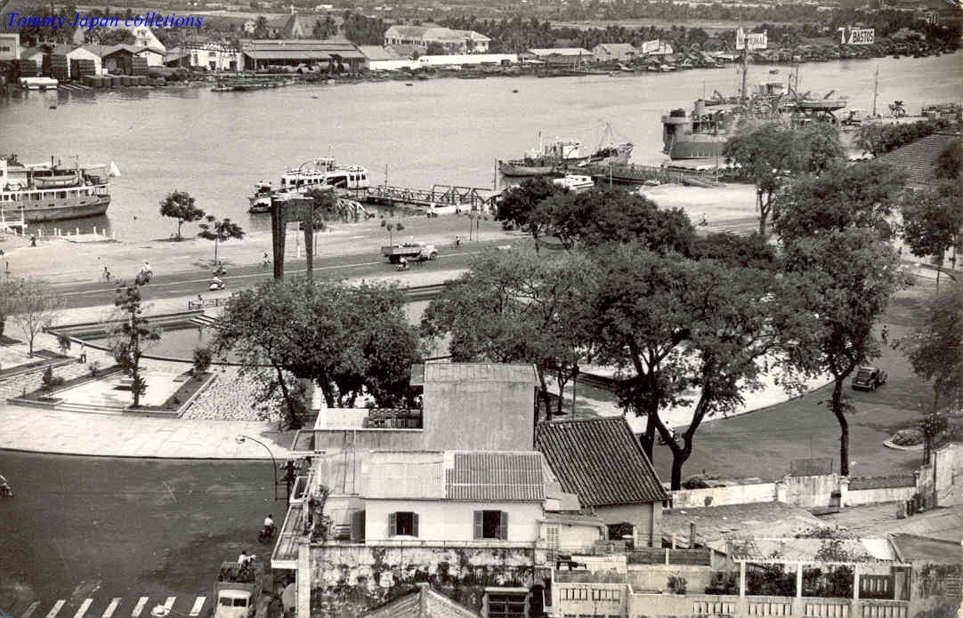 an old black and white po shows the boats in a harbor