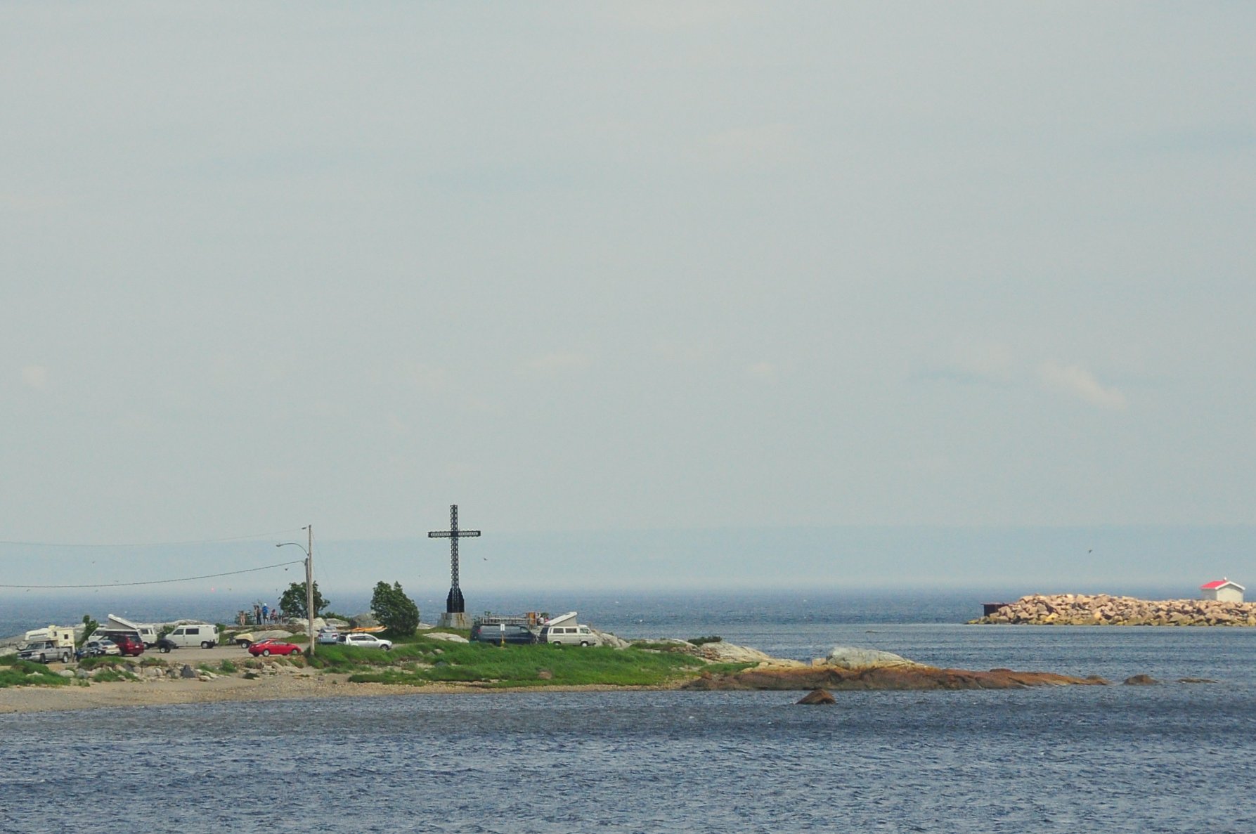 a light house on an island near the ocean
