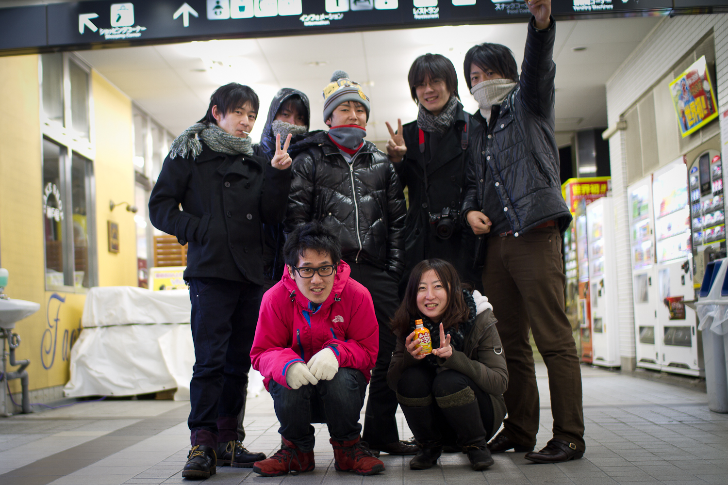 a group of people on the ground posing for a po