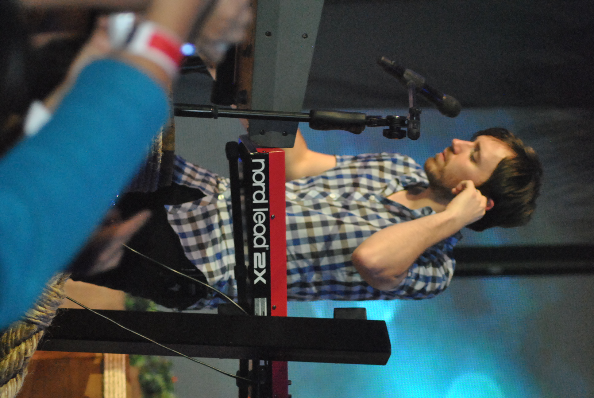a man is on the keyboard of a concert