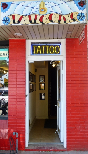 the tattoo parlor is painted a vint red color