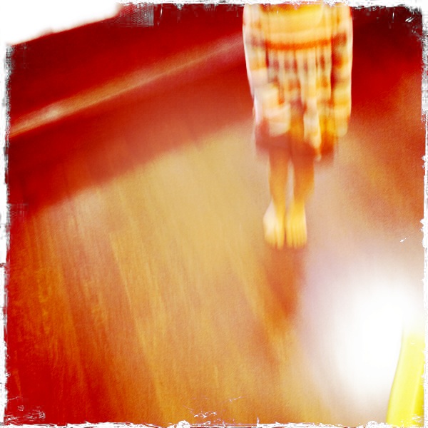 a blurry picture shows someone walking in a room