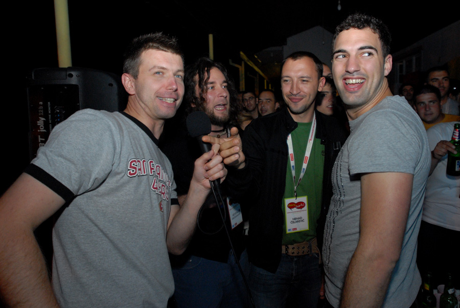 group of men gathered at club looking very happy