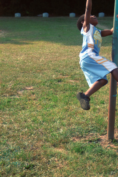 a  is doing stunts on the poles