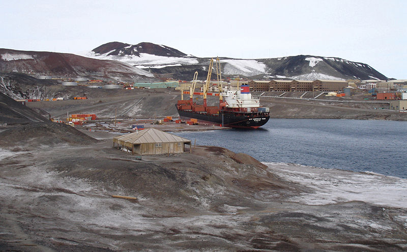 a large boat that is floating on some water