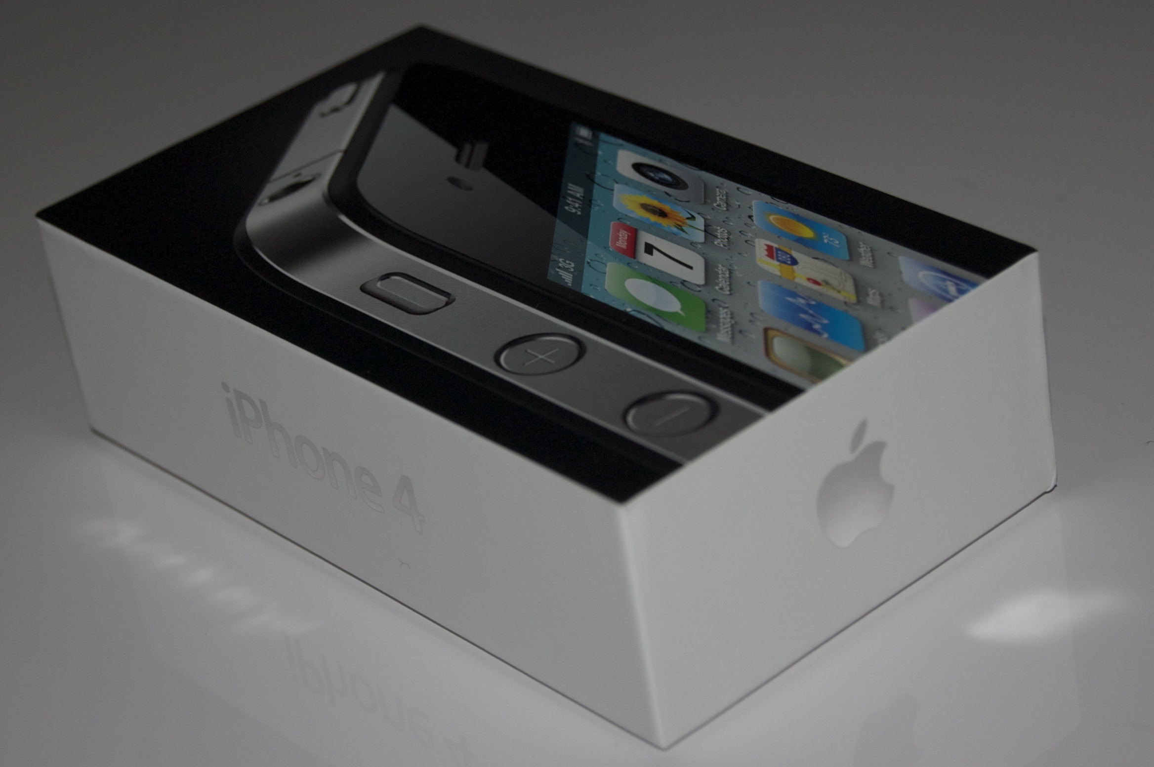 an iphone inside of a boxed box on the table