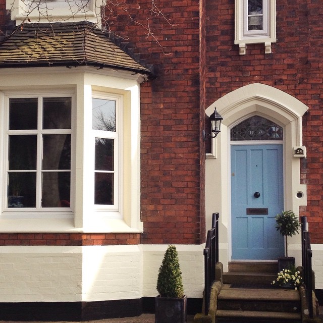the door to a home is shown painted blue
