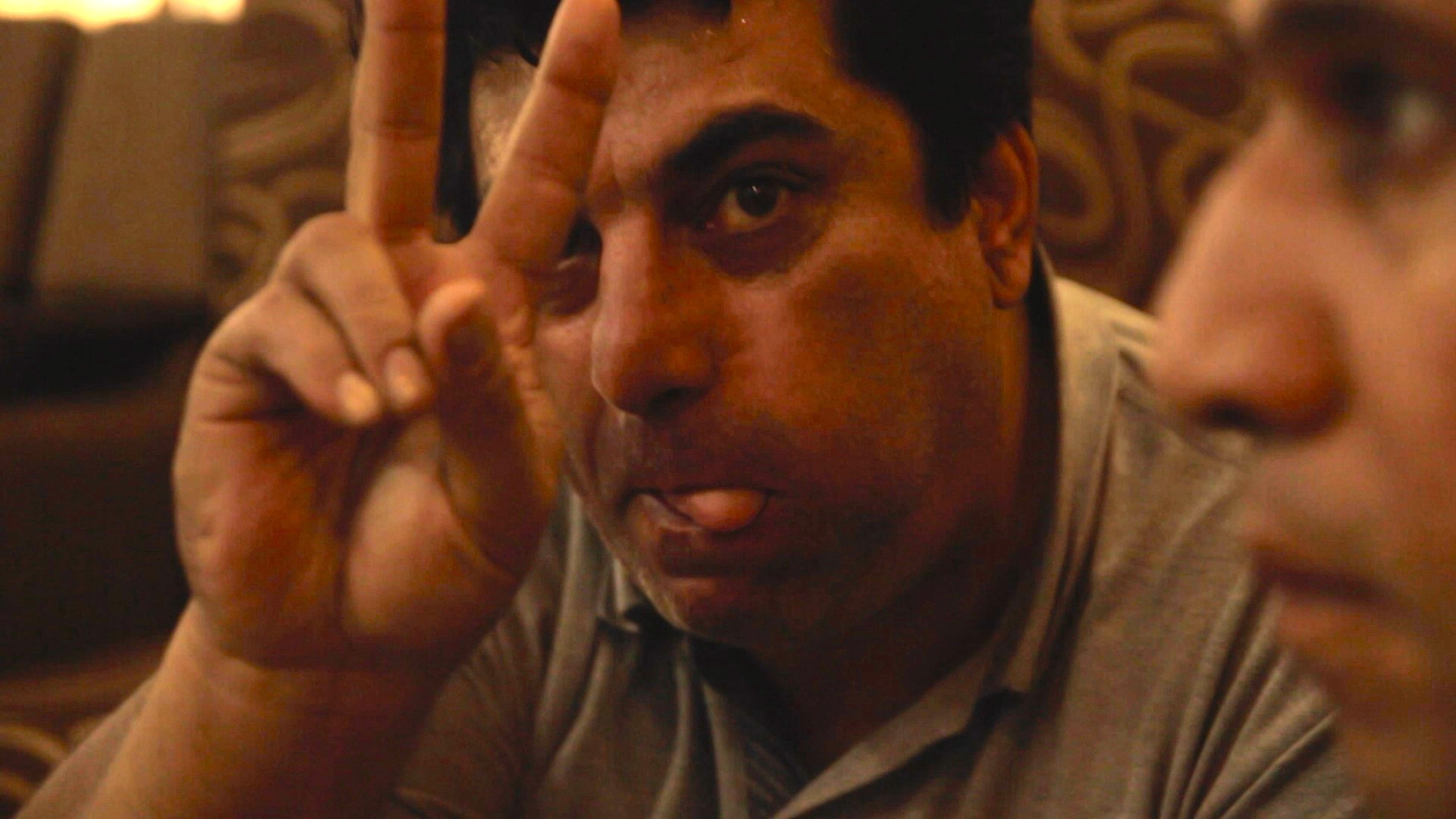 a person making the victory sign with their fingers