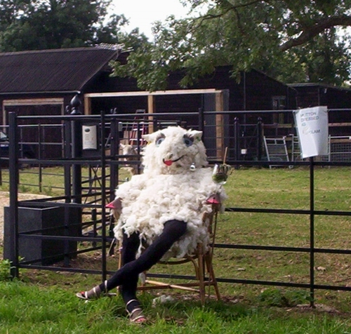 there is a fake animal that is posed in a chair