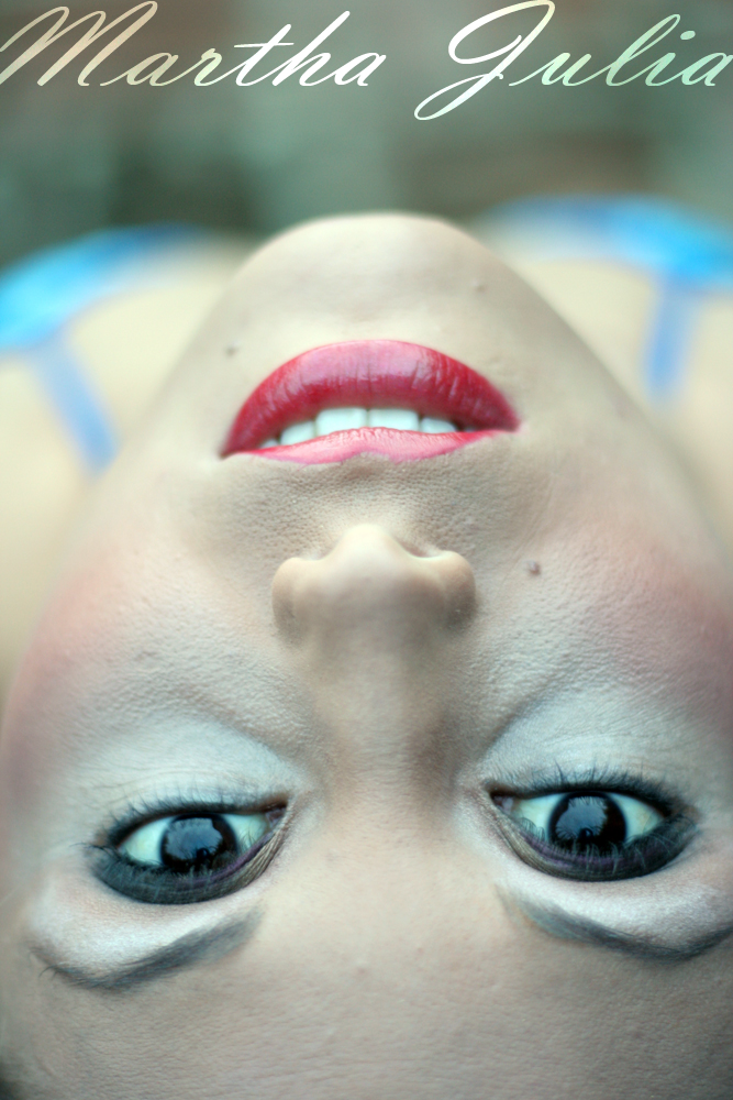 a mannequin with bright blue eyes and white eyelashes