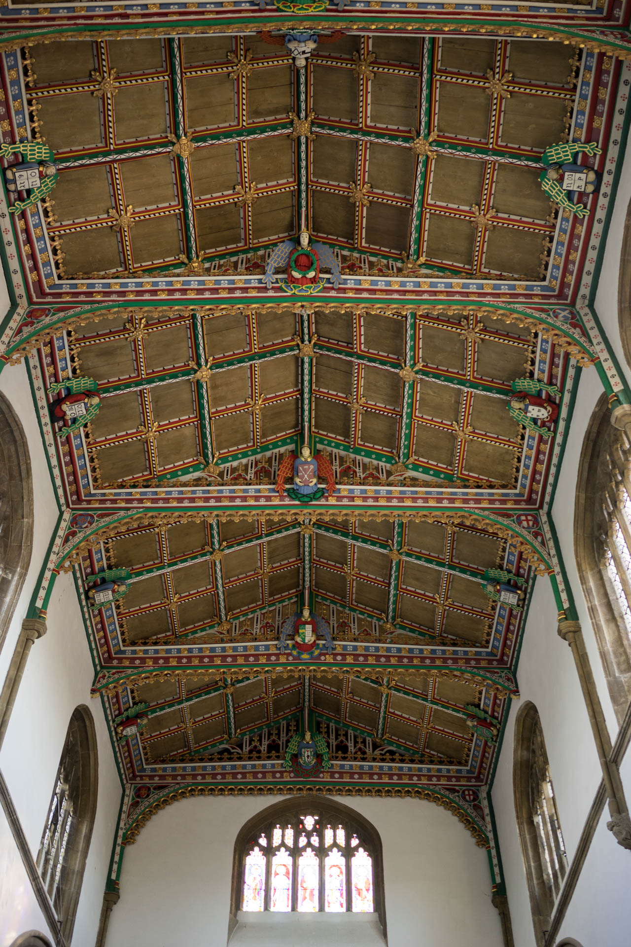 a cathedral with stained glass windows and painted ceilings