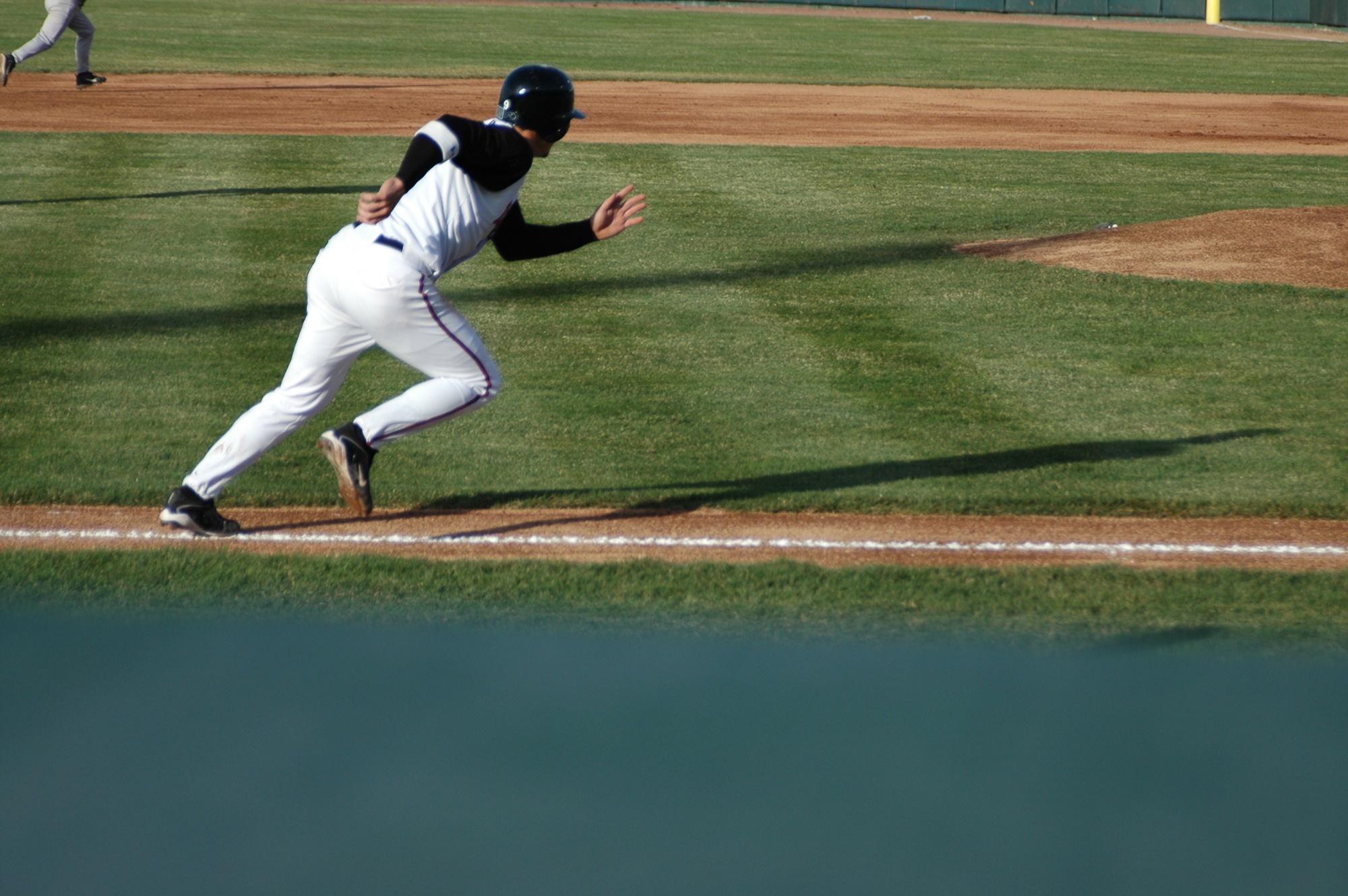 baseball player attempting to run during a game