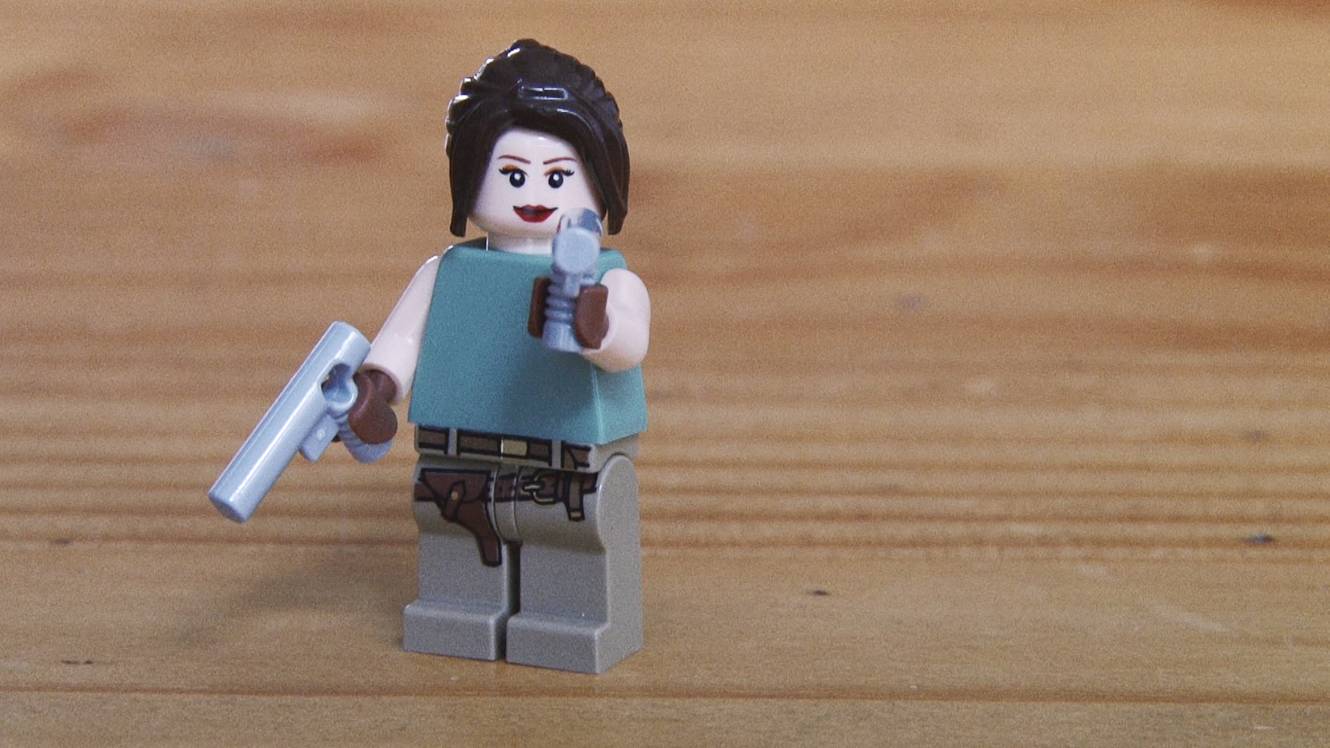a lego star wars character holding a gun and paper