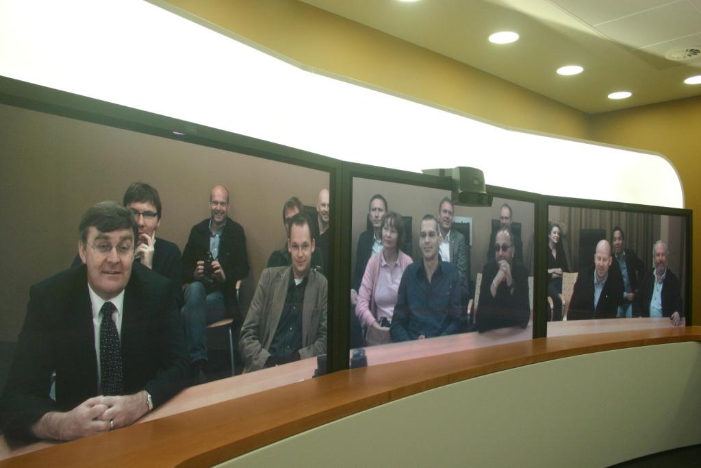 a wooden table topped with pos of people