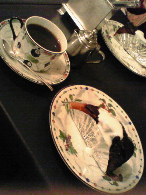two plates and two cups are half eaten