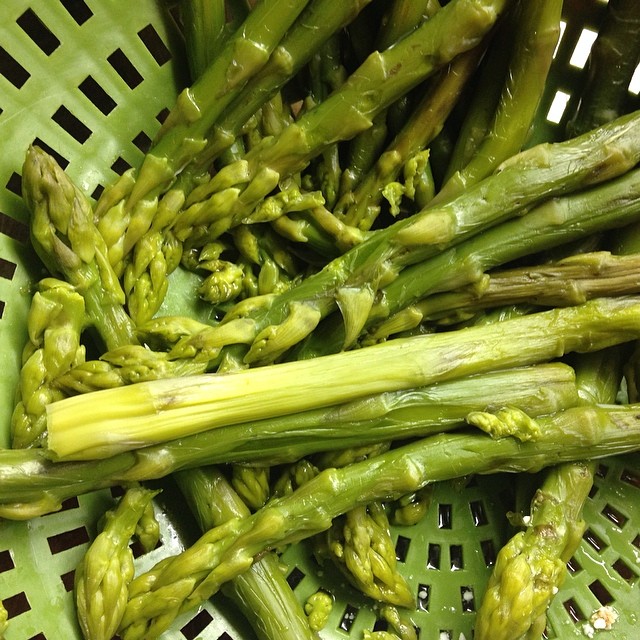 asparagus stems in a basket, uncooked