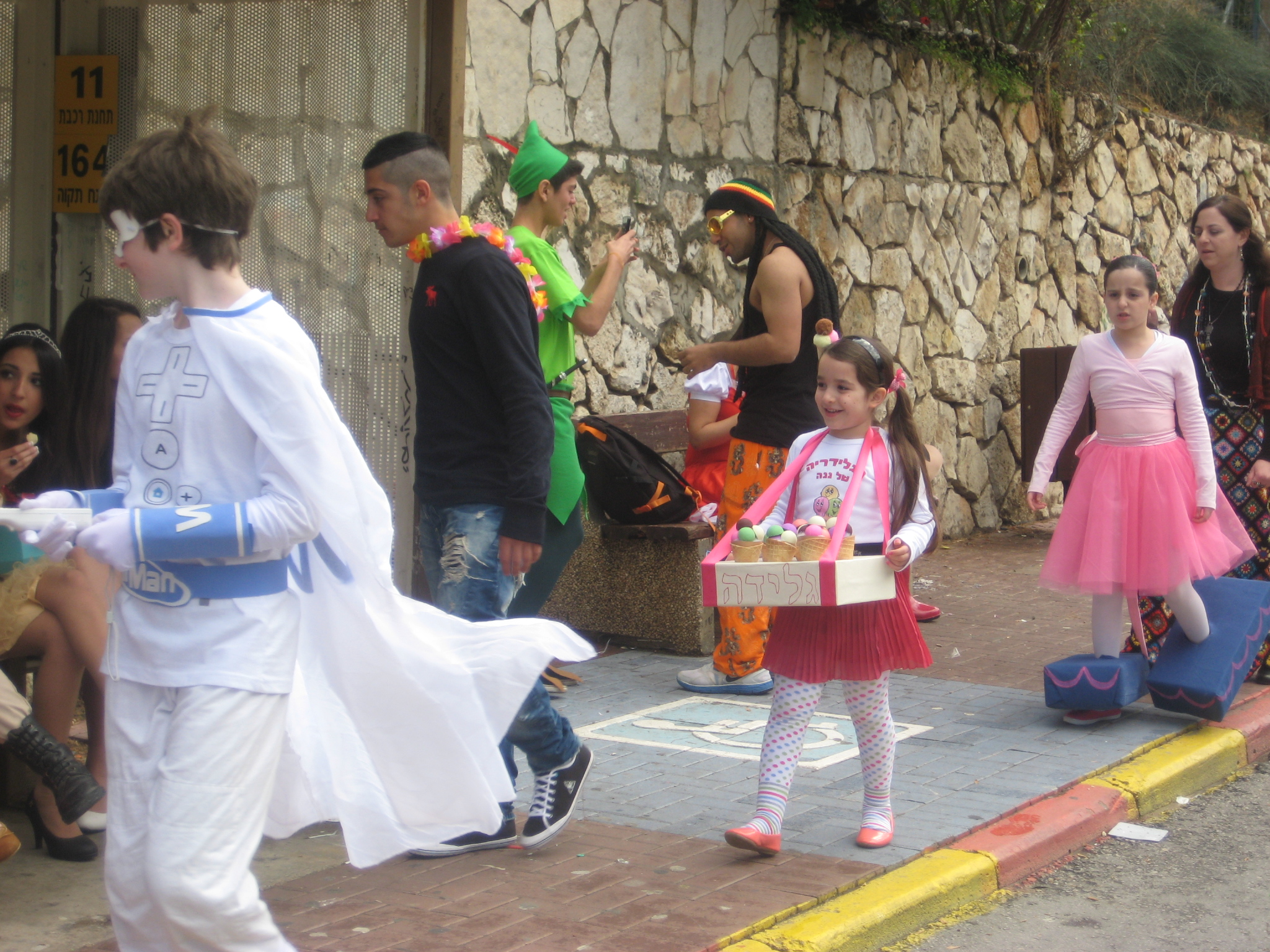 some s with a little girl dressed up as the flint boy and a woman in costume