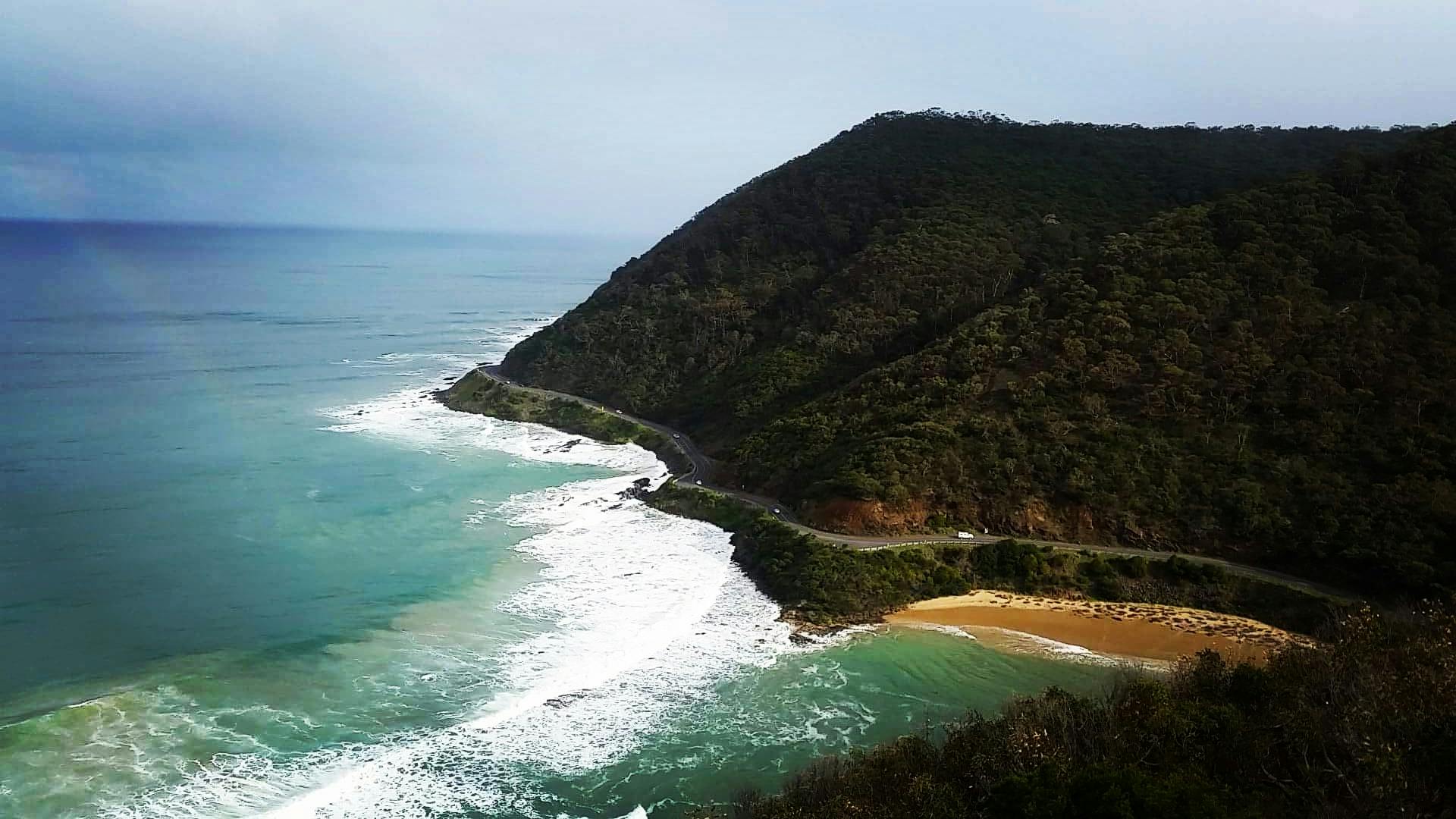 a view of the ocean from the top of a hill, by Lee Loughridge, pexels contest winner, renaissance, “ iron bark, landslide road, flowing cape, instagram post