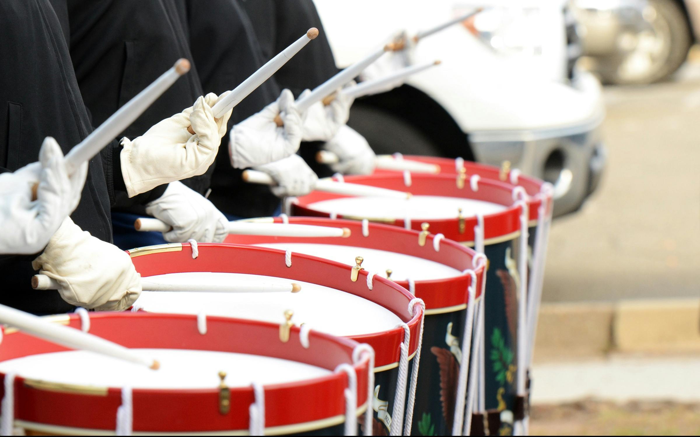 a group of people that are holding drums, by Alison Watt, shutterstock, hurufiyya, military parade, profile image, performing to dead soldiers, expert shading