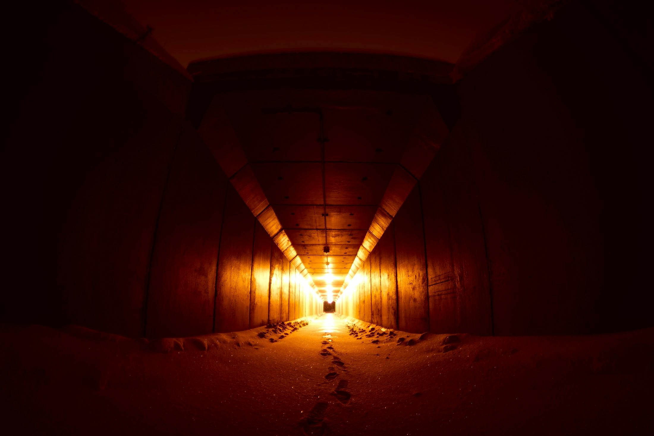 a light at the end of a tunnel, unsplash contest winner, conceptual art, warm orange lighting, golden age seraph bunkers, industrial photography, profile image