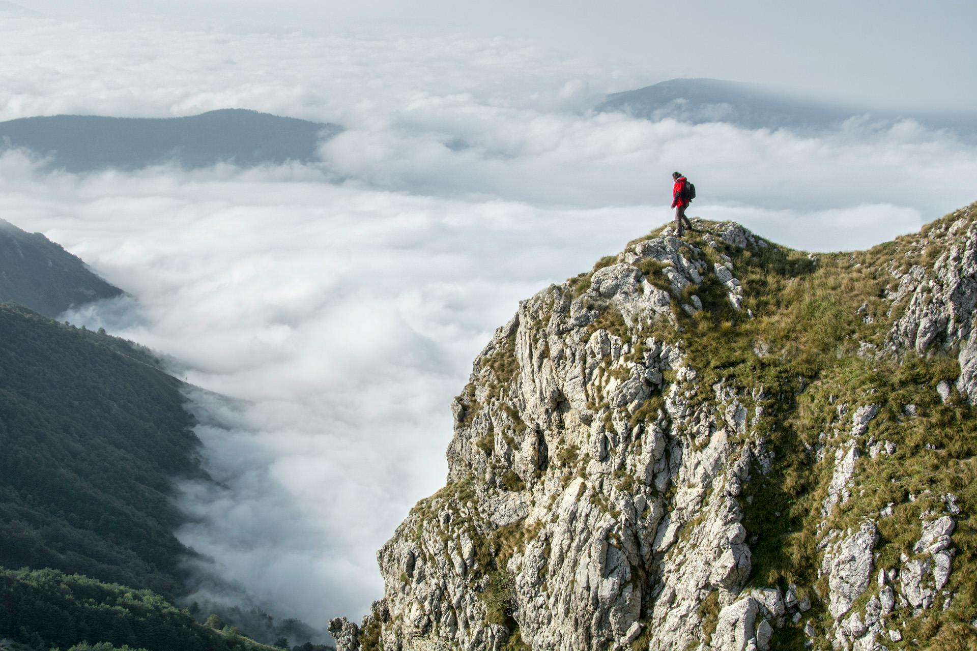 a person standing on top of a mountain, by Adam Marczyński, pexels contest winner, on clouds, avatar image
