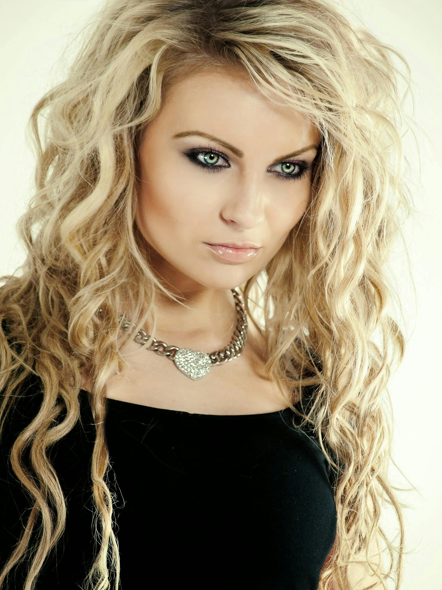 a woman with long blonde hair posing for a picture, trending on deviantart, wearing black choker, half - length photo