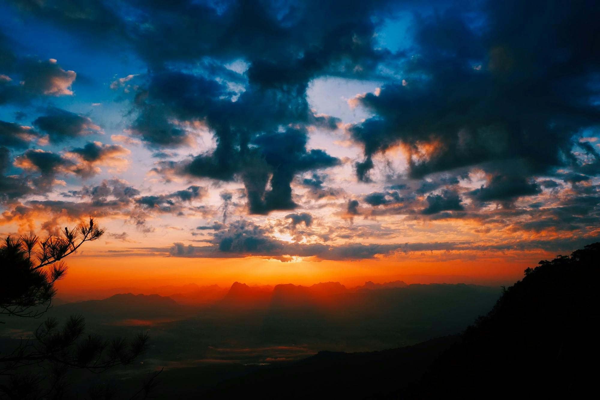 a view of a sunset from the top of a mountain, pexels contest winner, romanticism, orange and blue colors, instagram post, clouds around, multiple stories