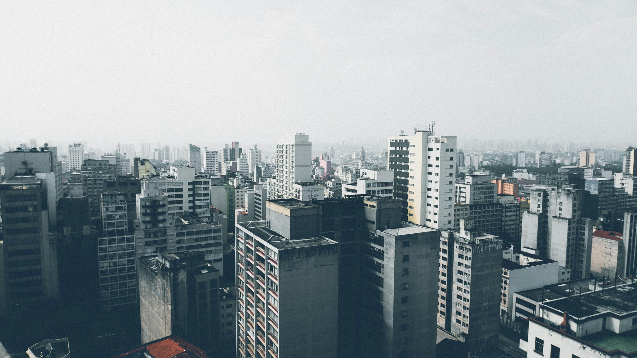 a view of a city from a high rise building, pexels contest winner, brutalism, brazilian, 1980s photo, small buildings, complex and desaturated