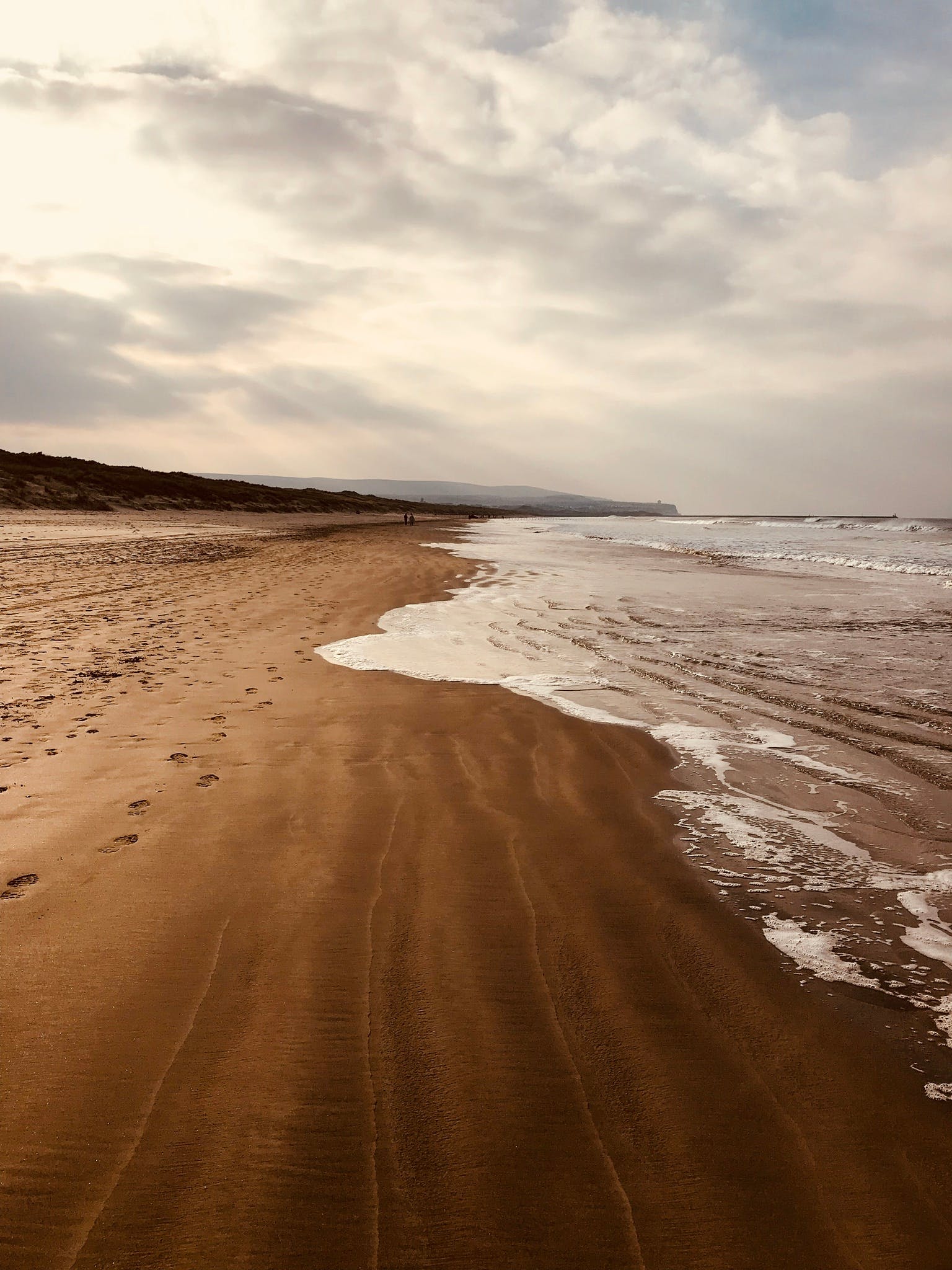 a man riding a surfboard on top of a sandy beach, brown water, omaha beach, profile image