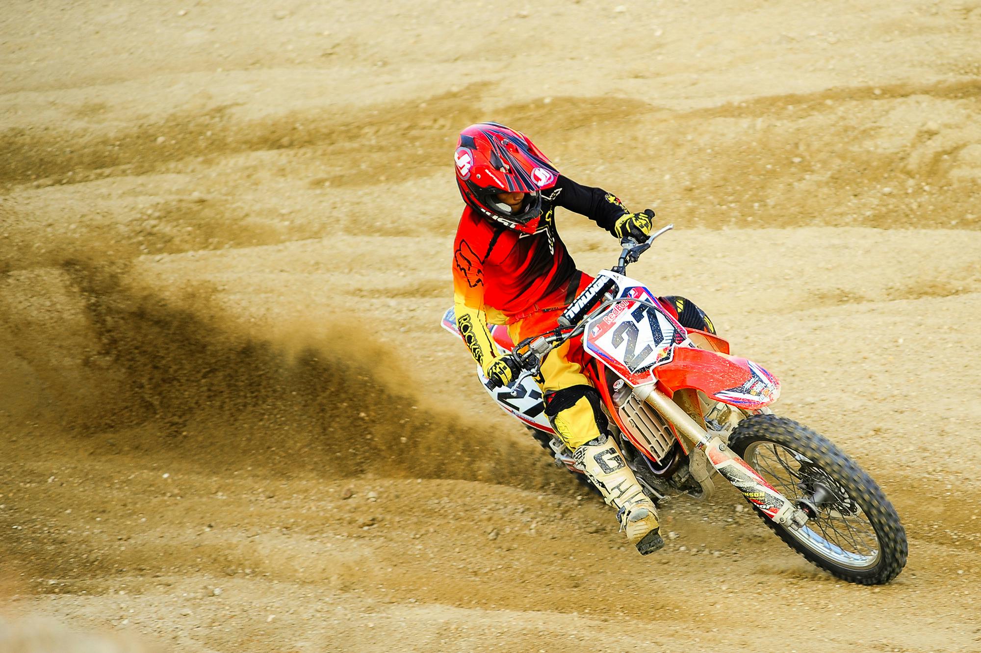 a person riding a dirt bike on a dirt track, pexels contest winner, red and yellow scheme, avatar image, sports photo, profile picture