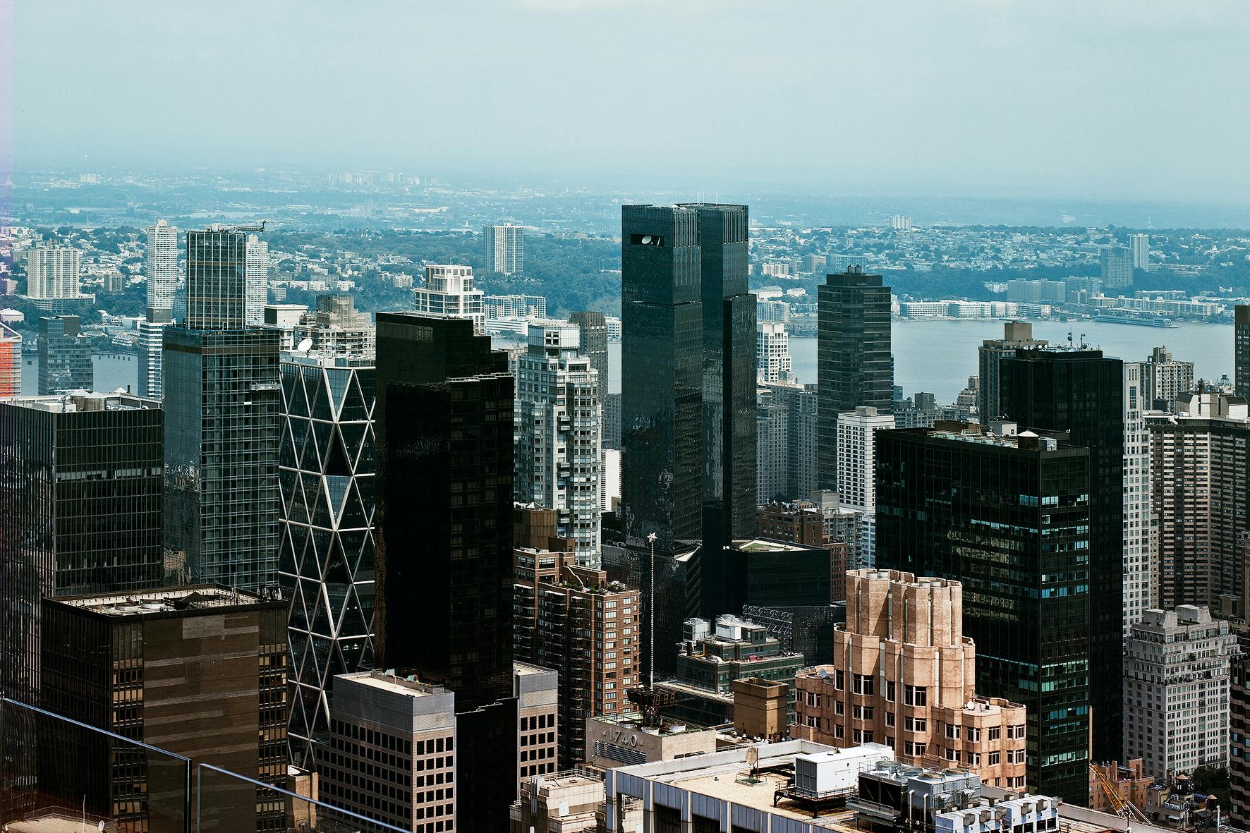 a view of a city from the top of a building, inspired by Thomas Struth, pexels contest winner, regionalism, new york buildings, slide show, 8 k hi - res, mies van der rohe