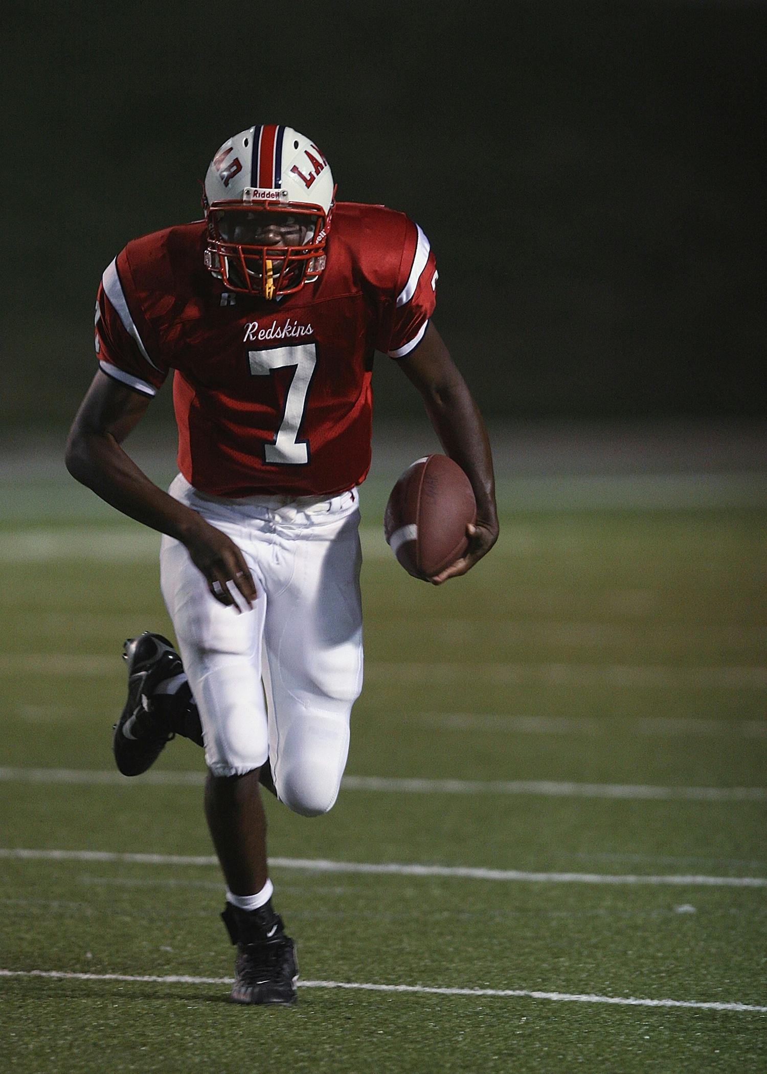 a man running with a football on a field, by Terrell James, happening, '0 0 s nostalgia, iu, high quality image, visuals