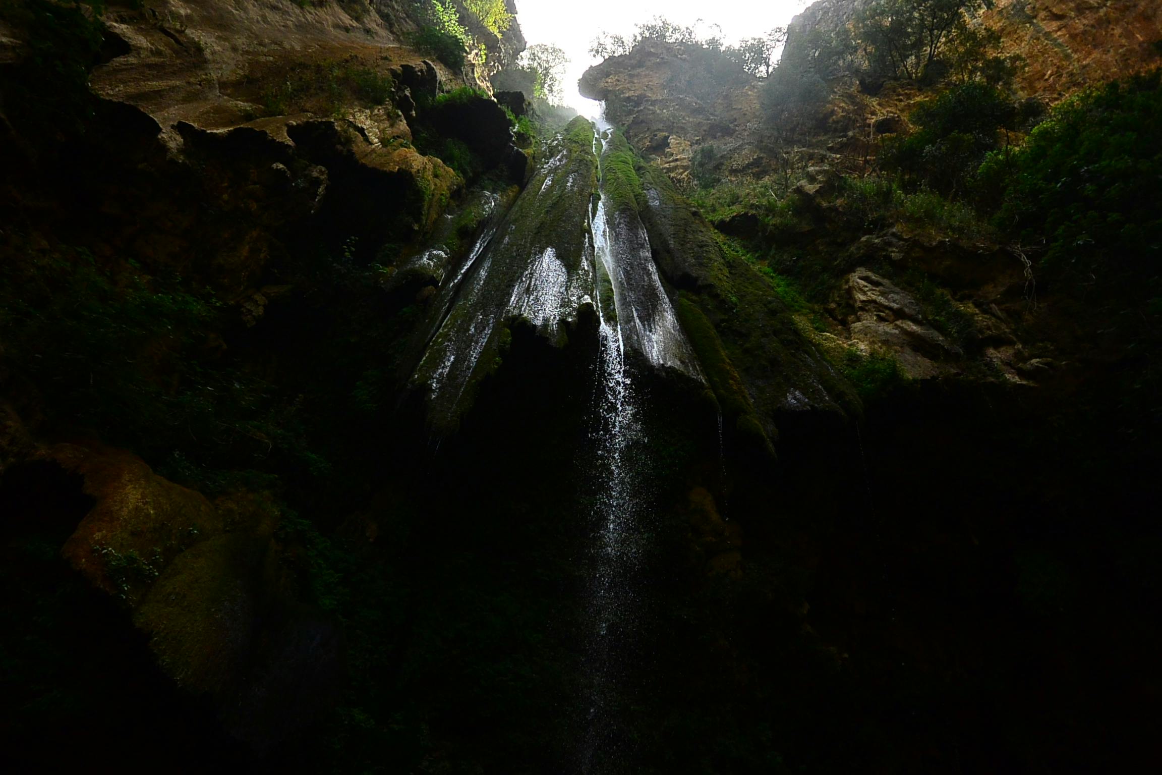 there is a waterfall coming out of a cave, les nabis, light from above, the lost valley, highly upvoted, high quality photos