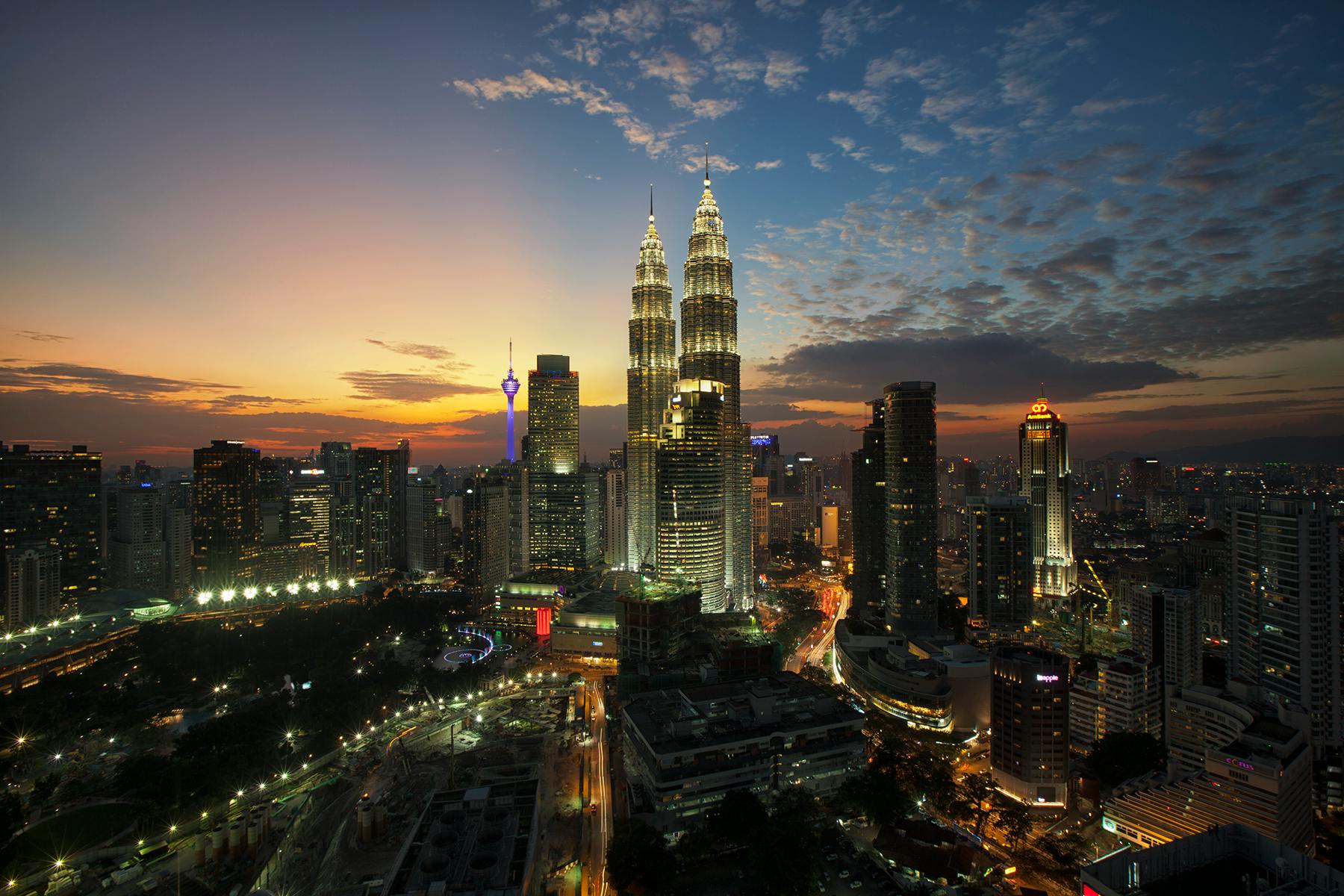 an aerial view of a city at night, by Basuki Abdullah, pexels contest winner, hurufiyya, tall spires, beautiful sunny day, malaysian, 8k hd resolution”