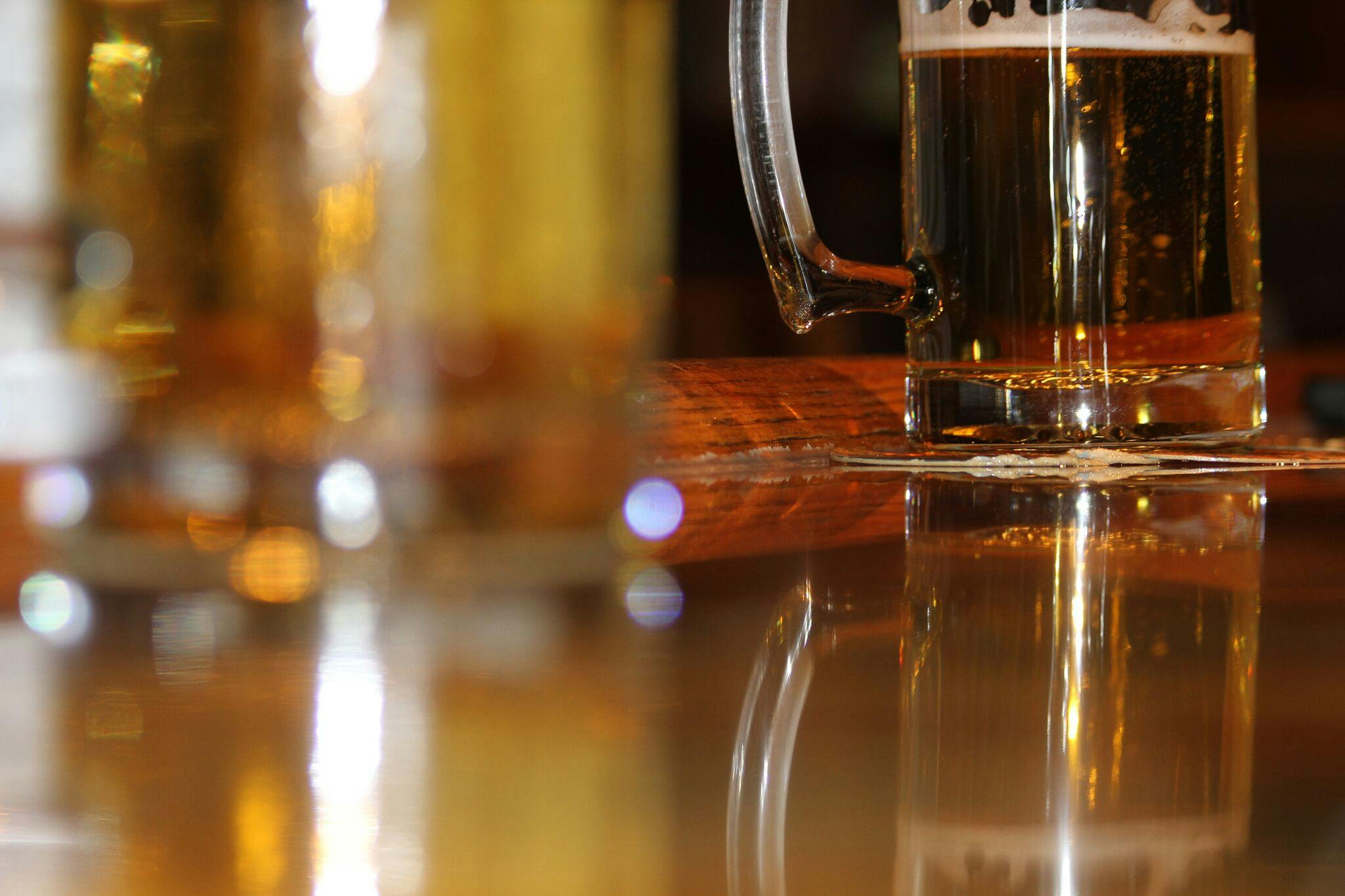 a close up of a glass of beer on a table, by Carey Morris, pexels, hyperrealism, glossy reflections, brown, gold, thumbnail