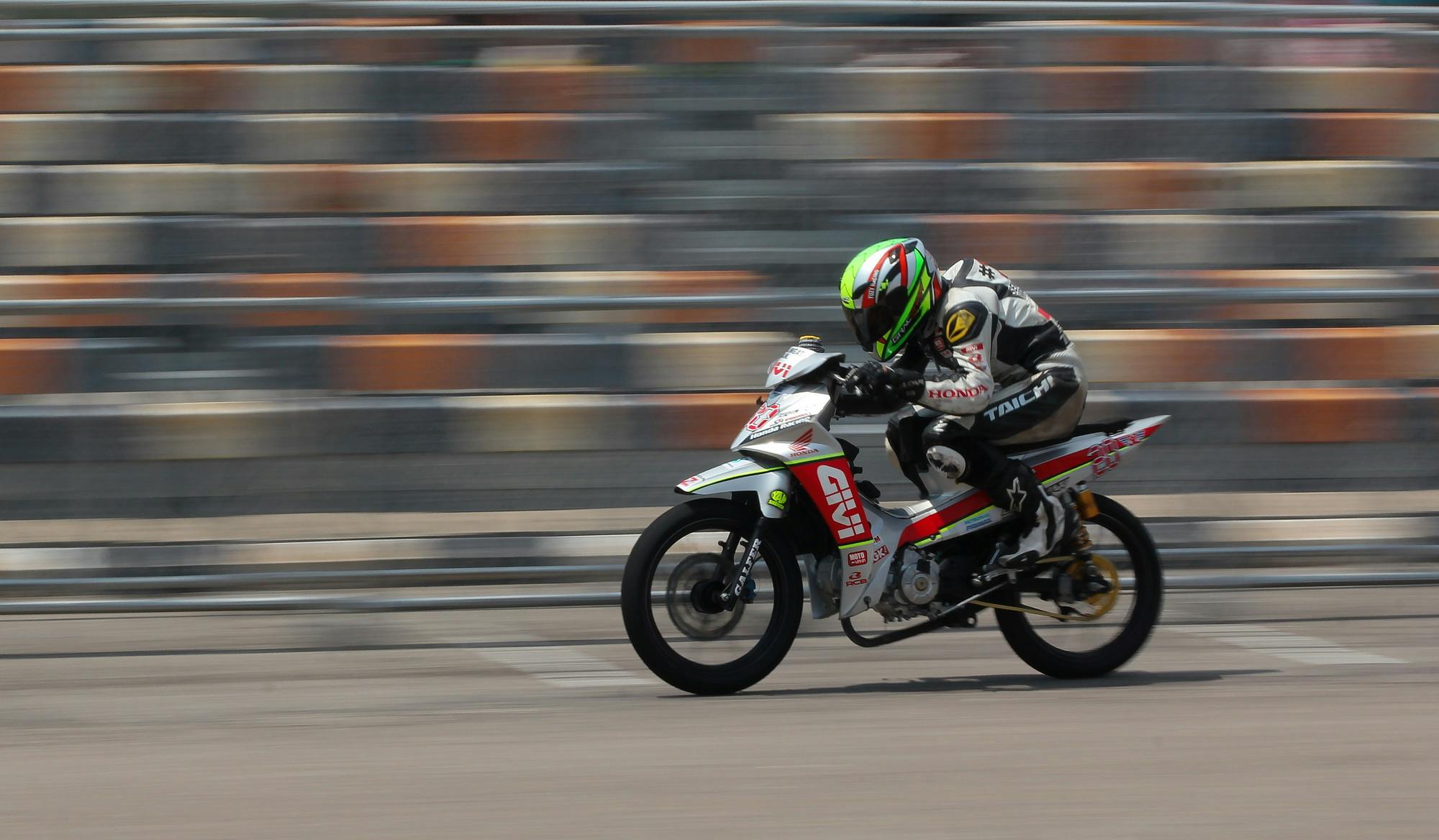 a person is riding a motorcycle on a track