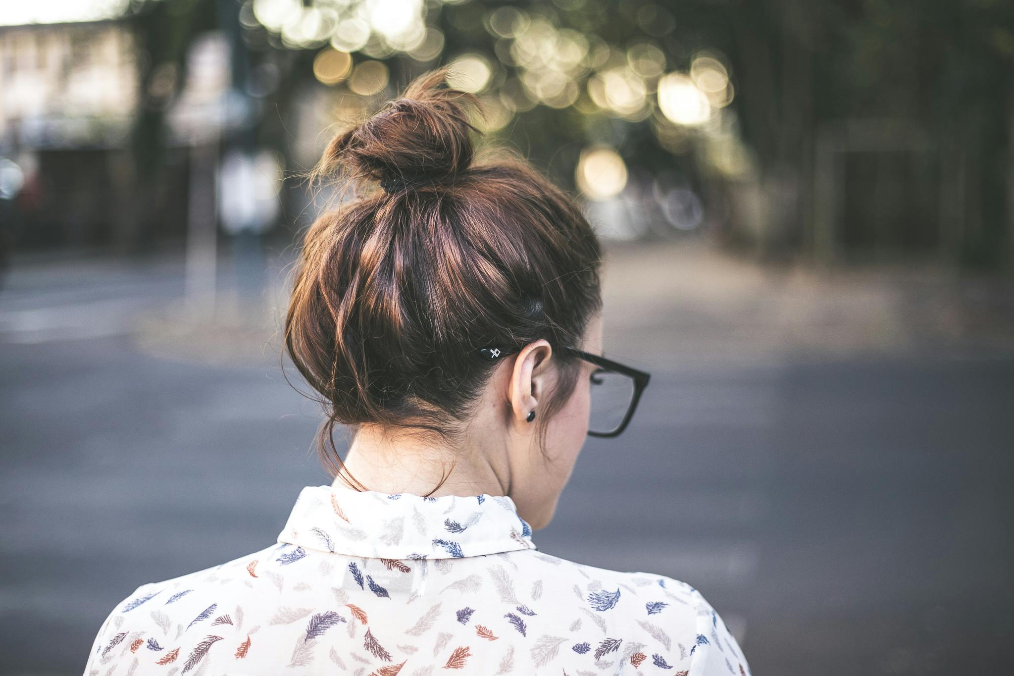 a close up of a woman with glasses