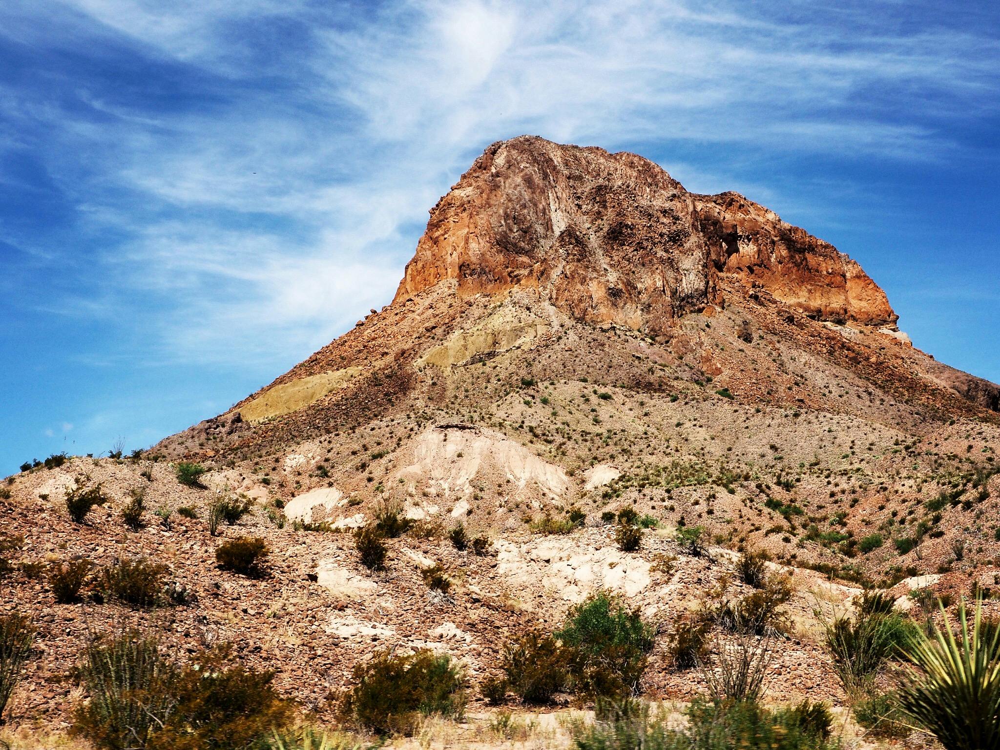 a mountain that looks like it is on top of some dirt