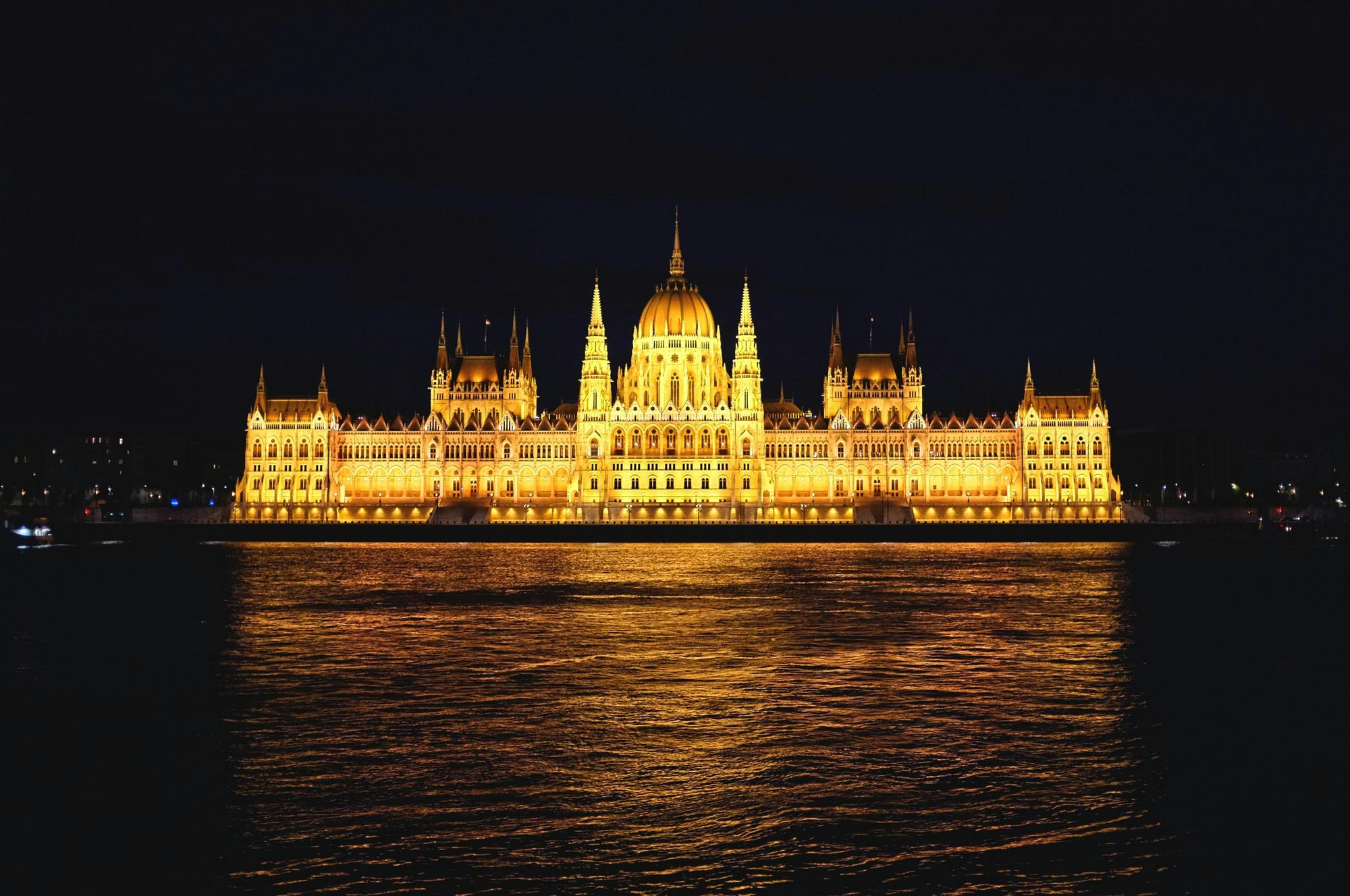 an illuminated picture of the hungarian parliament building
