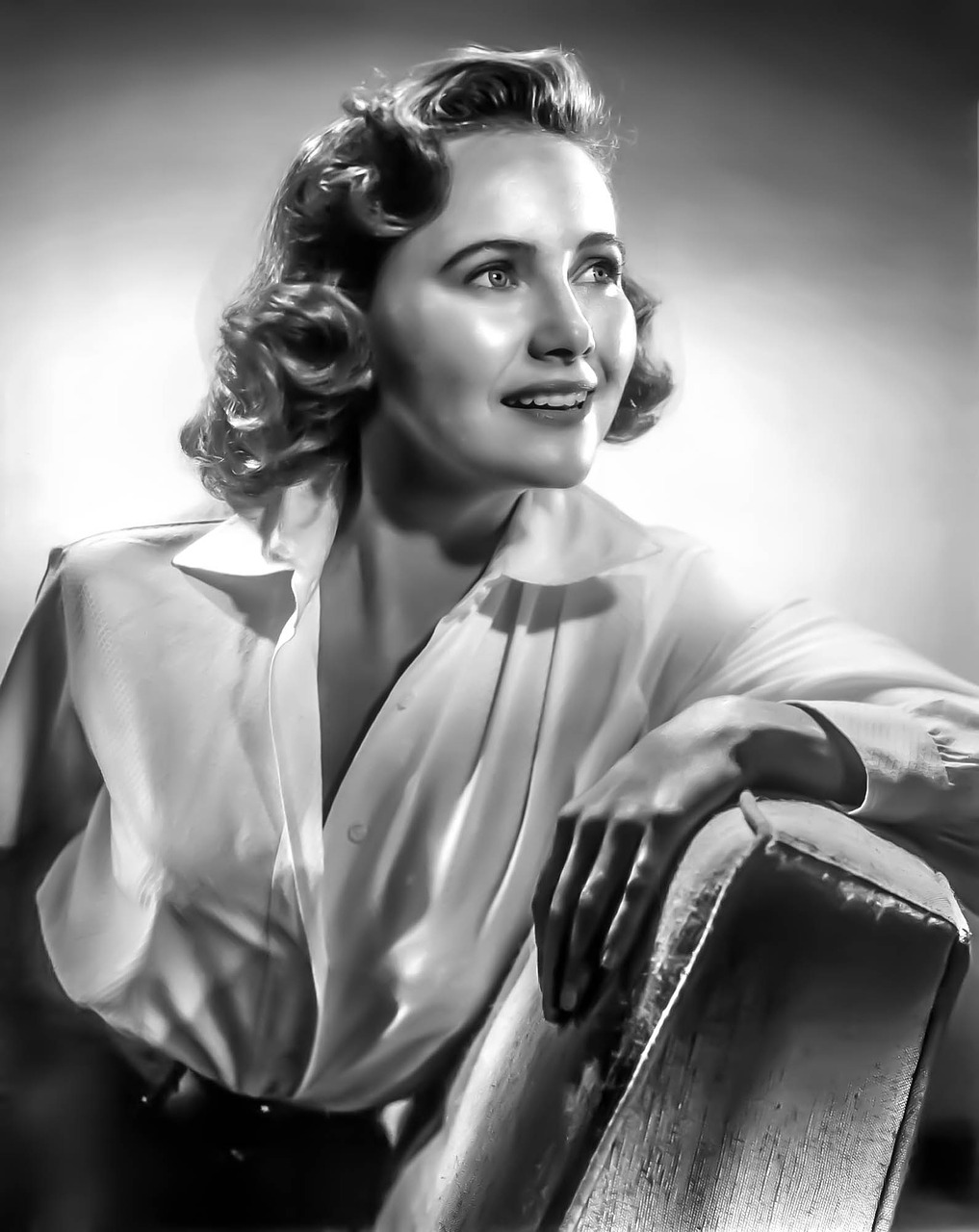 a black and white photo of a woman leaning on a chair, a portrait, inspired by Yousuf Karsh, featured on pixabay, airbrush render, dana scully, detailed color portrait, gil elvgren 50mm