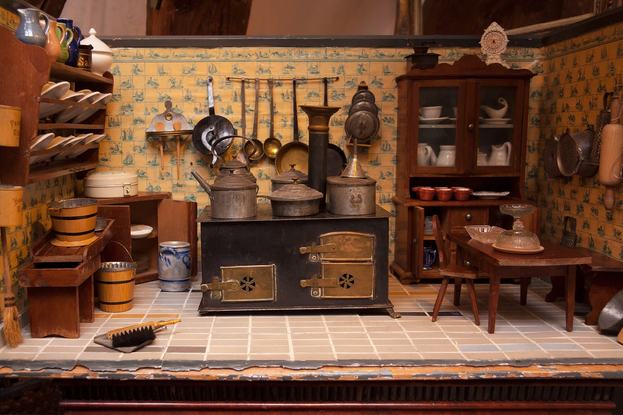 a miniature kitchen filled with pots and pans, by Betye Saar, trending on polycount, photo of a victorian dollhouse, detailed image, french village interior, miscellaneous objects