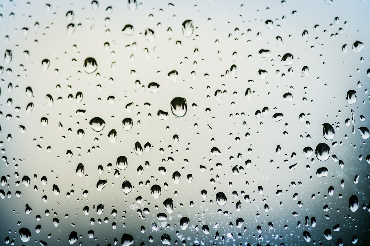 a bunch of drops of water on a window, by Jan Rustem, shutterstock, minimalism, surface reflections, wallpaper for monitor, rain sensor, low angle photo