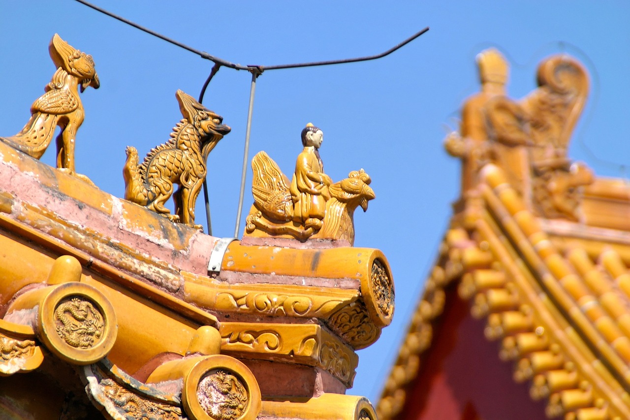 a group of statues sitting on top of a roof, a statue, trending on cg society, cloisonnism, baotou china, ocher details, rich colour and detail, in the sun