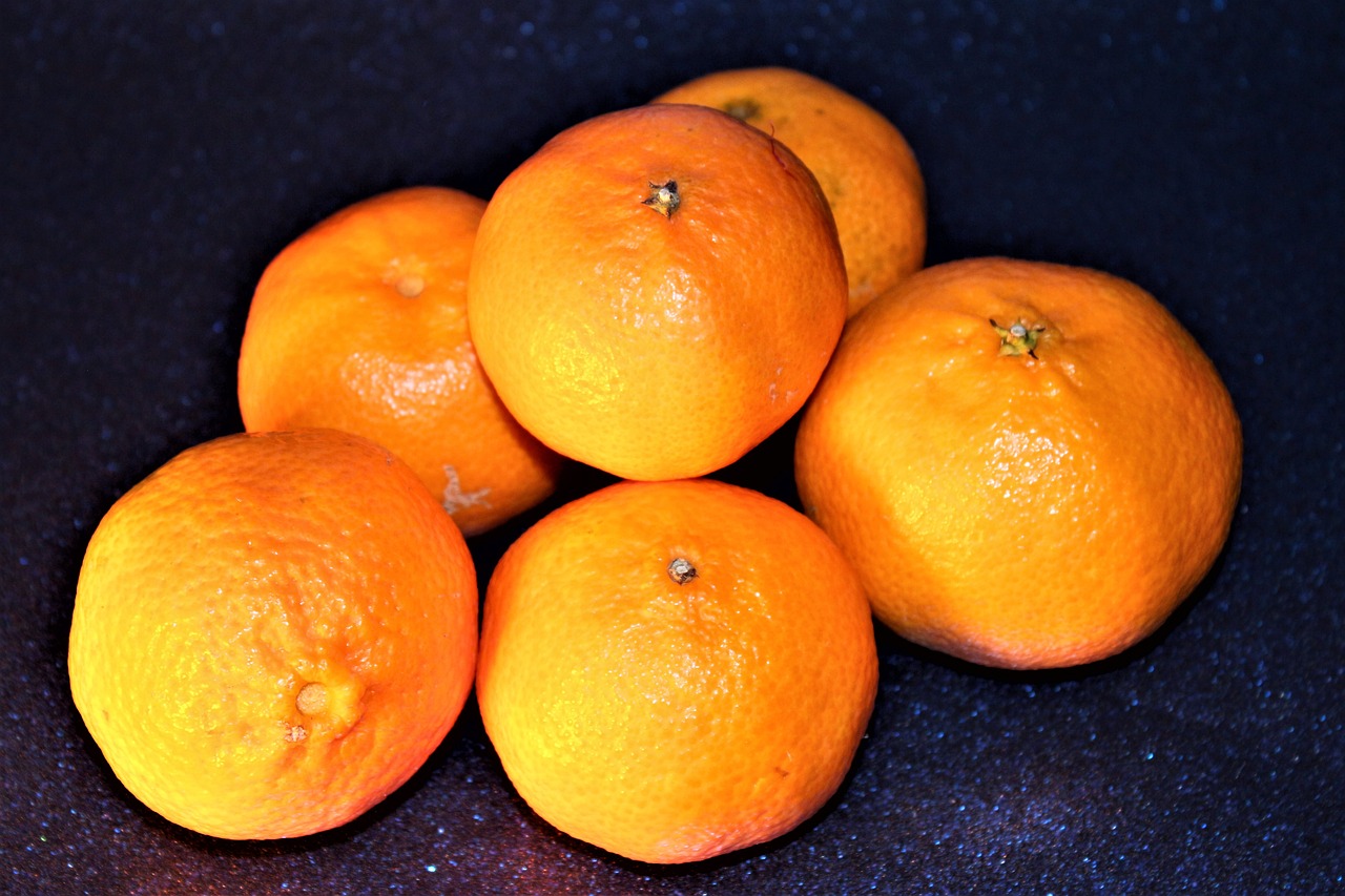 a pile of oranges sitting on top of a table, by Jan Rustem, high detailed photo, profile pic, high quality product image”