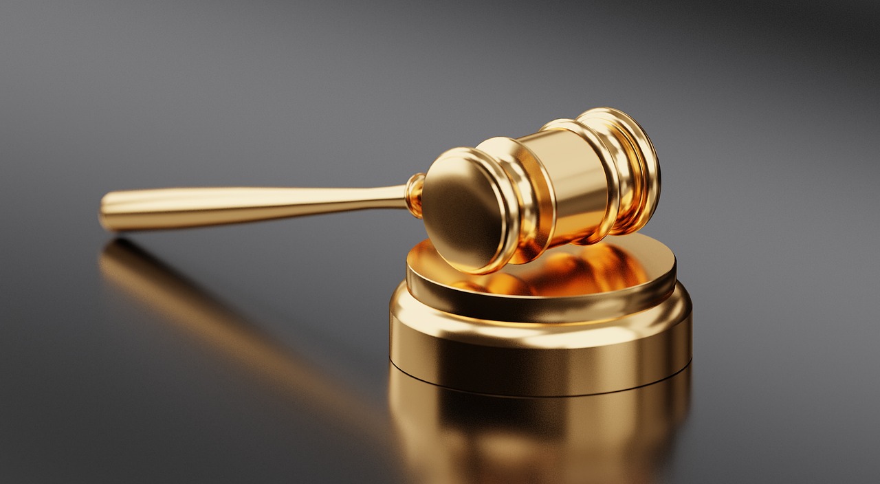 a golden gavel sitting on top of a black table, sharply detailed, smooth detailed, less detailing, detaild
