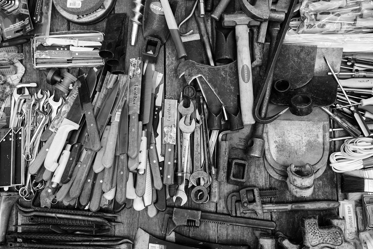 a black and white photo of a bunch of tools, pexels, assemblage, 🦑 design, repeating 3 5 mm photography, beautiful image, pièce de résistance