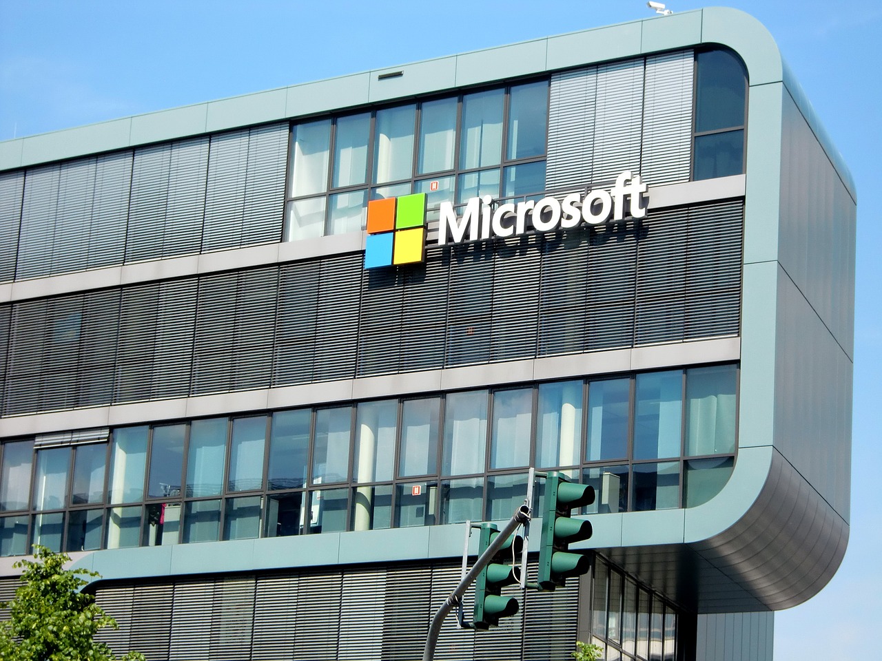 the microsoft logo is displayed on the side of a building, a screenshot, by Kurt Roesch, shutterstock, usa-sep 20, electronic billboards, very detailed picture, stacked image