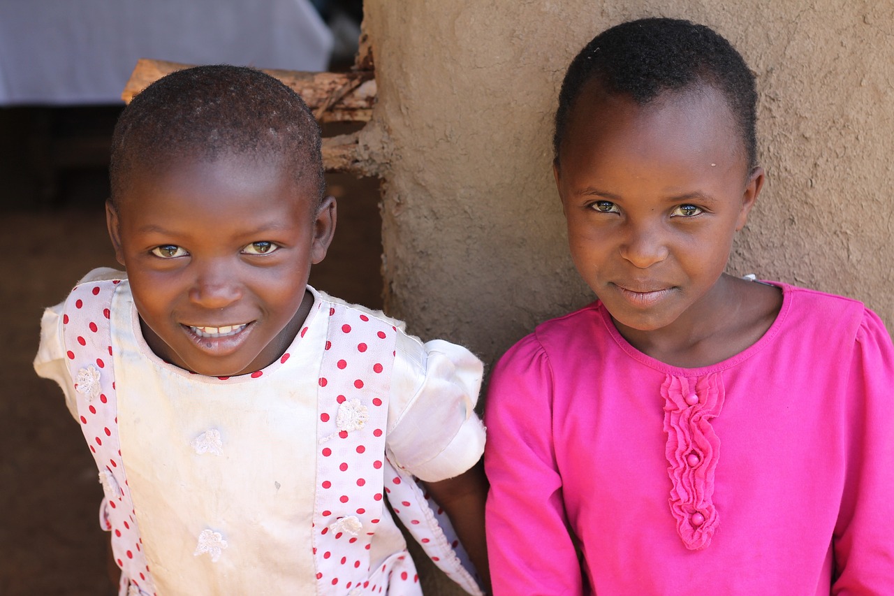 a couple of young children standing next to each other, by Ingrida Kadaka, flickr, hurufiyya, bottom angle, while smiling for a photograph, emmanuel shiru, beautiful girls
