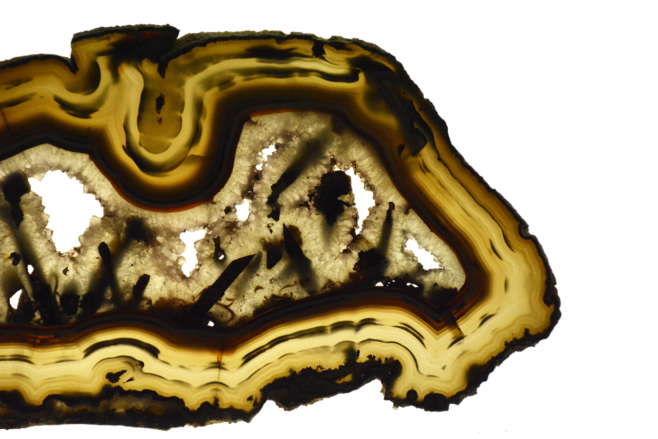 a slice of agate sitting on top of a table, a microscopic photo, flickr, conceptual art, rorsach path traced, 2 0 th century, highly detailed rock structures, top view